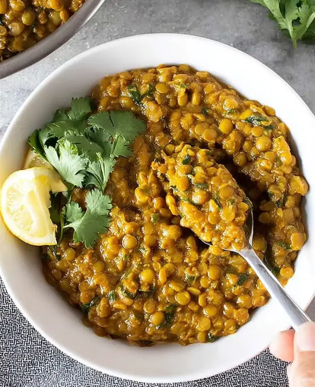 Mung bean curry served in a bowl with spices and coconut, perfect for healthy meals.